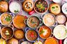 overhead shot of various soups in different bowls