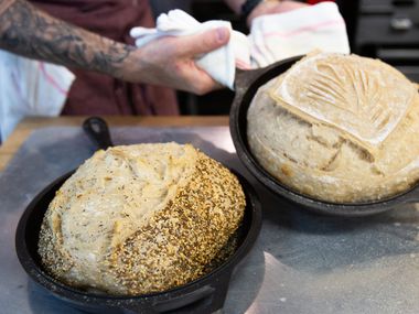 Matt Bresnan, head chef at Food Company, removes two loaves of bread in the Nonna kitchen in Highland Park.