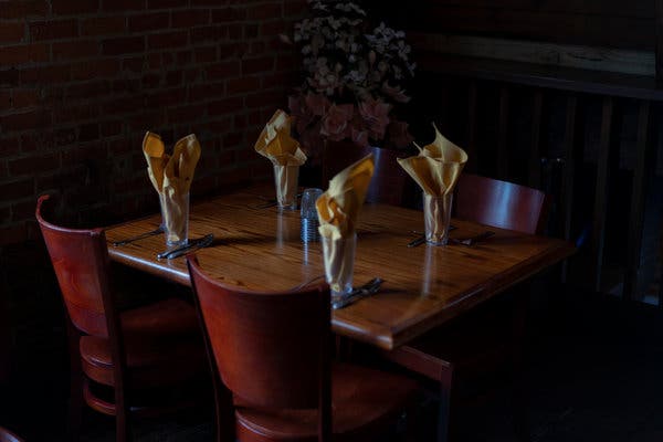 An empty table at a restaurant in Dayton, Ohio, on March 15, the last day before bars and restaurants were closed in that state.