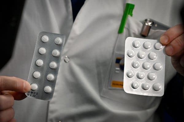 Packets of Nivaquine tablets containing chloroquine, and Plaquenil tablets containing hydroxychloroquine. Both drugs have been promoted by President Trump as a coronavirus treatment.