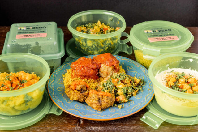 Reusable containers filled with takeout food from El Harissa Market Cafe in Ann Arbor. For their study, U-M researchers studied the pilot program for returnable takeout containers launched by the nonprofit organization Live Zero Waste in Ann Arbor. (Photo courtesy of Live Zero Waste)